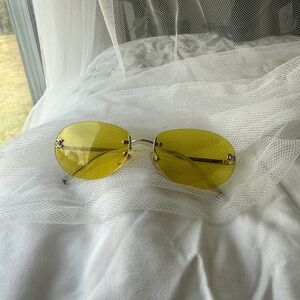 CHANEL Yellow Rimless Oval Sunglasses